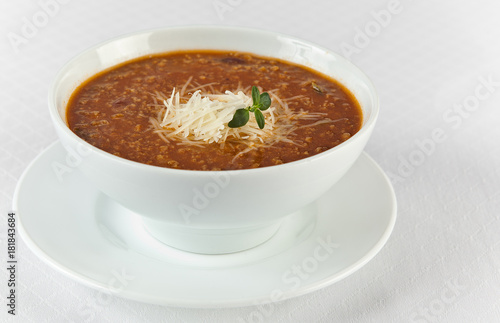 hot and spicy beef soup with cheese in a bowl photo