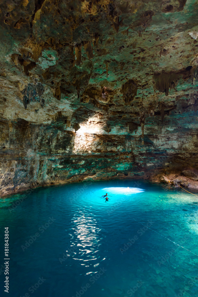 Naklejka premium Cenote Samula Dzitnup near Valladolid, Yucatan, Mexico - swimming in crystal blue water