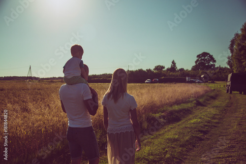 Silhouette of loving family. Family together. go near the .Rye field. in evening.   Concept of friendly  and loving family.  The models is not visible. © Lelde Feldmane