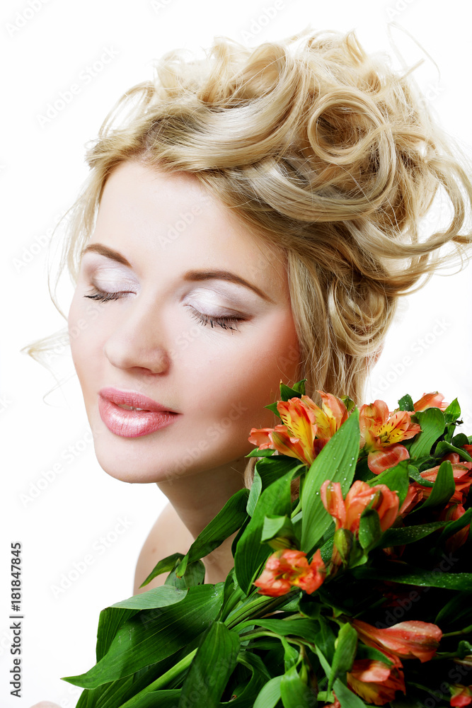 Beautiful blond girl with flowers on a white background. Beautiful blond girl with flowers on a white background.