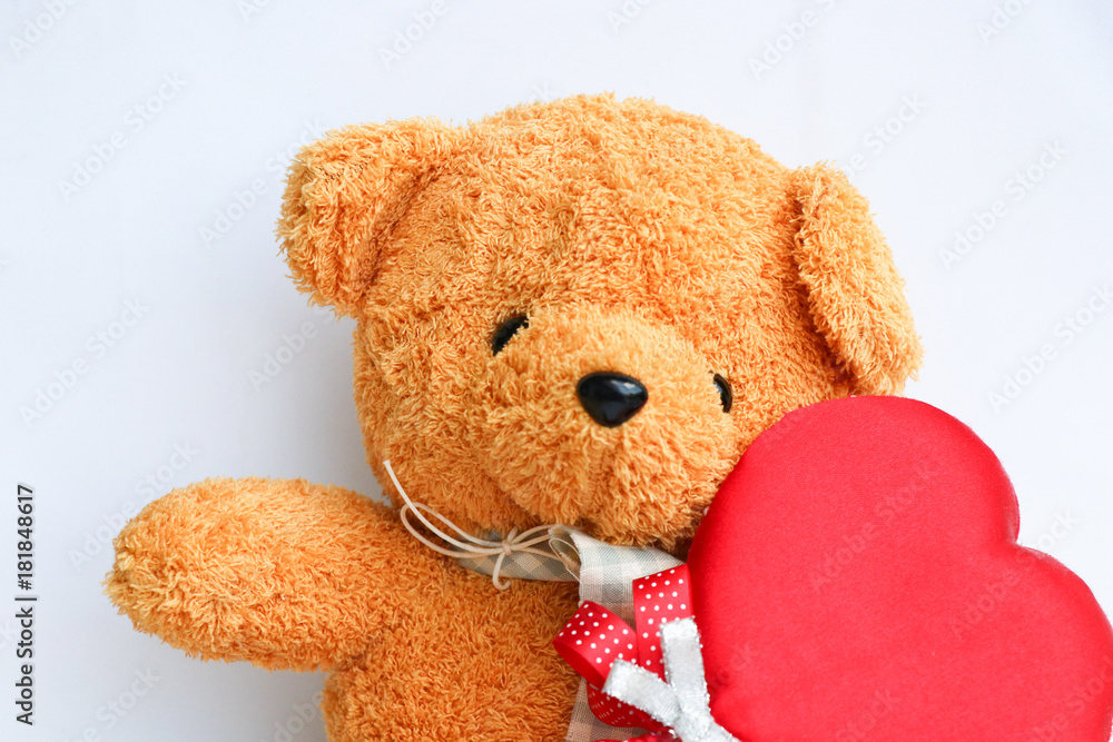 Cute Teddy bear with red heart symbol on white background Cute Teddy bear with red heart symbol on white background