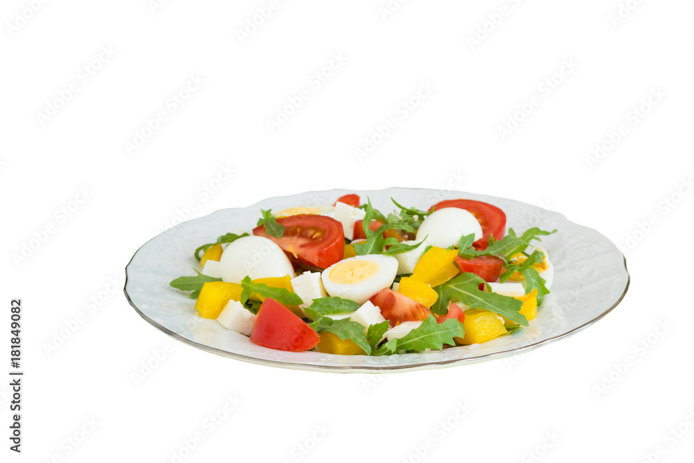 Vegetable salad on a plate on a white background.