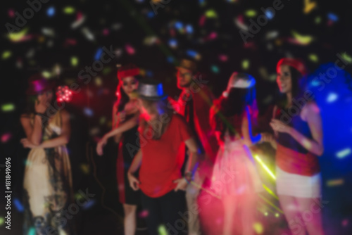 Blurred People in Party - Group of Friends Enjoy Throwing Confetti and Dancing in Nightclub