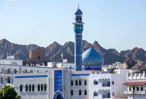Blue Dome and Minaret of Mutrah Mosque with mountain in Background - Muscat, Oman photo