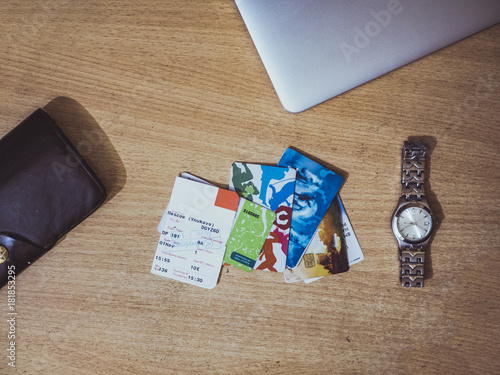 travel cards ticket watches laptop on the table isolated photo