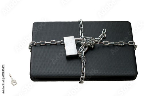 Laptop wrapped in a chain isolated on a white background, computer security