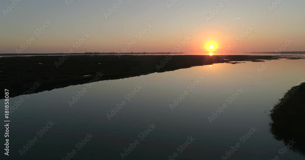 Aerial sunset seascape in Ria Formosa wetlands natural park, inland maritime channel. Algarve. Portugal. Aerial sunset seascape in Ria Formosa wetlands natural park, inland maritime channel. Algarve. Portugal.