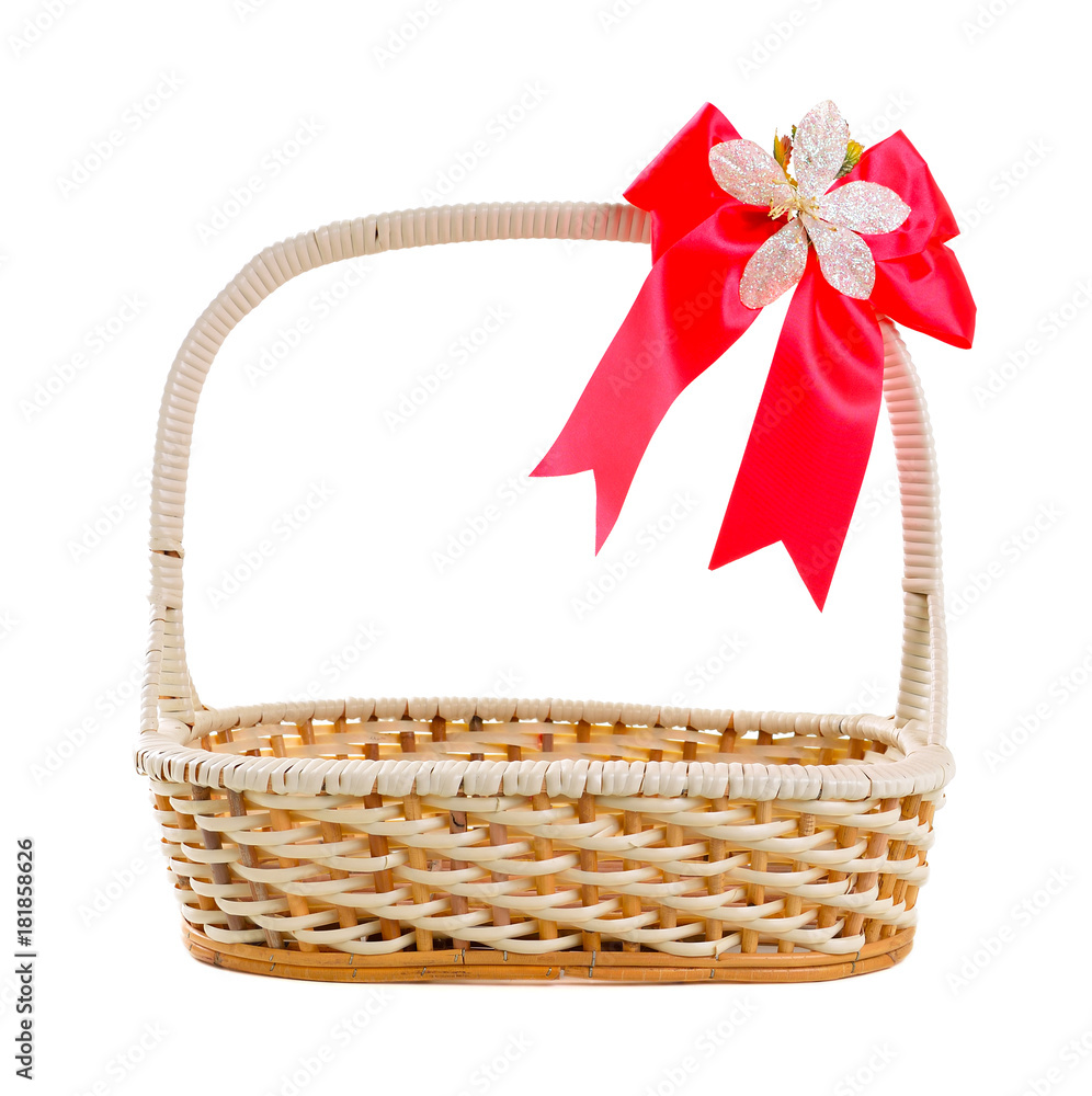 Empty wicker basket with bow isolated on white background