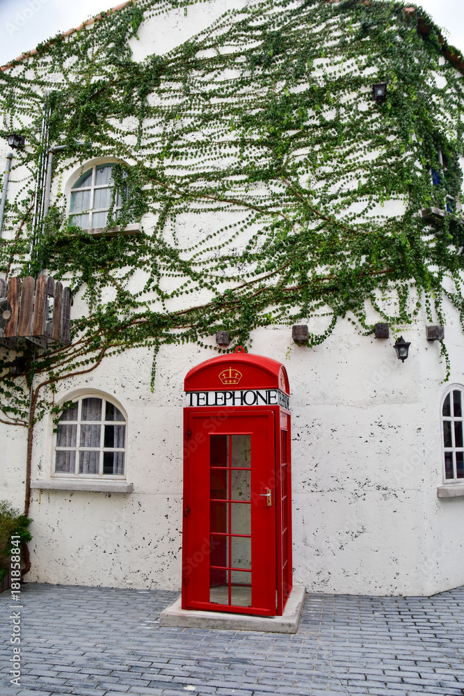 Fototapeta premium Red phone box with new technology
