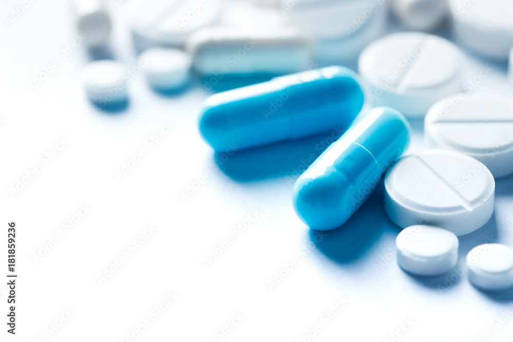 Pharmacy theme, blue medicine tablets.