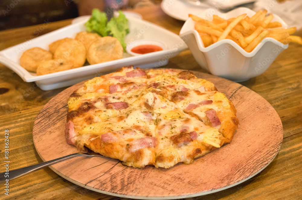 pizza put on wooden plate