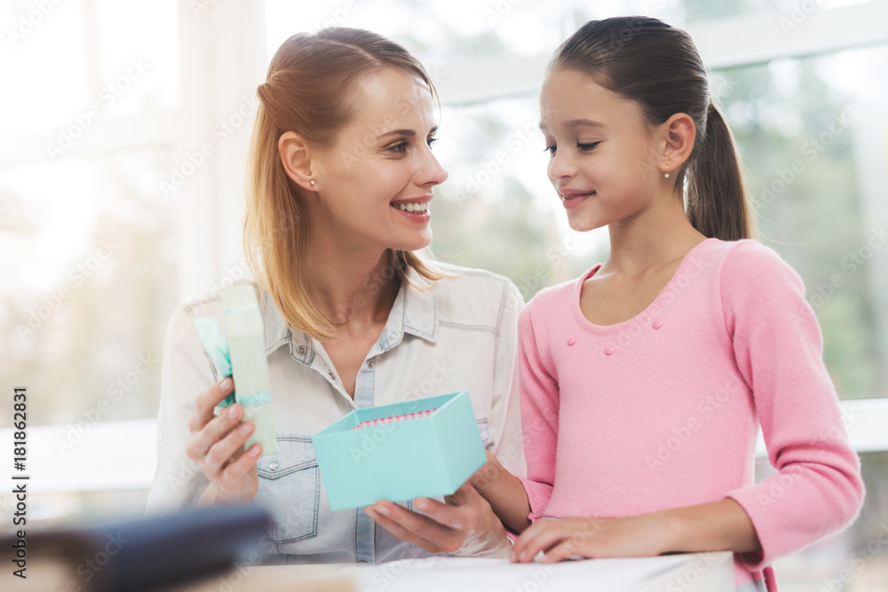 Working woman on maternity leave. The daughter made a present for her beloved mother. Working woman on maternity leave. The daughter made a present for her beloved mother.