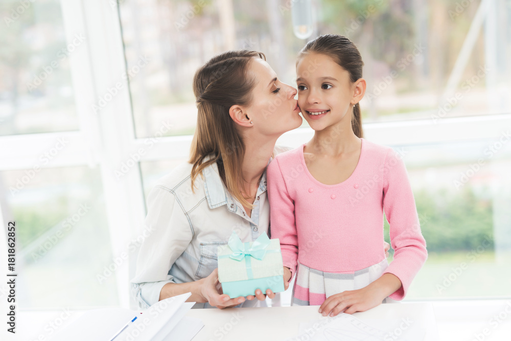 Working woman on maternity leave. The daughter made a present for her beloved mother. Working woman on maternity leave. The daughter made a present for her beloved mother.