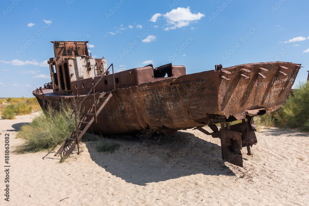 Rusted abandoned vessel in the ship cemetery of Aral Sea, Muynak, Uzbekistan