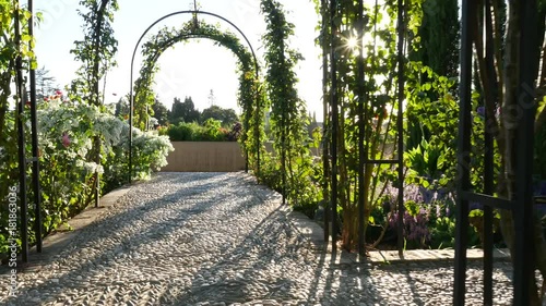 Stunning stone path with garden arches