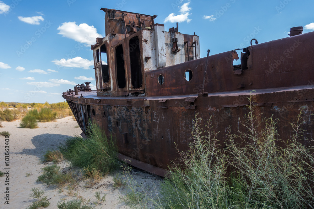 Abandoned ship on the Aral Sea, one of the biggest enviromental disaster in the world, Muynak, Uzbekistan Abandoned ship on the Aral Sea, one of the biggest enviromental disaster in the world, Muynak, Uzbekistan