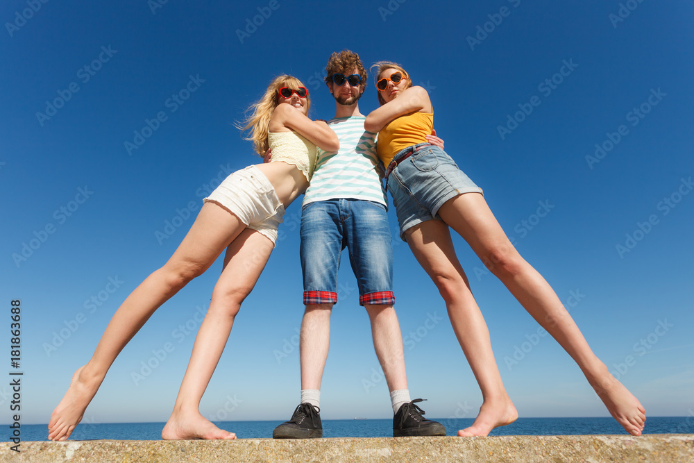 Group friends boy two girls having fun outdoor Group friends boy two girls having fun outdoor