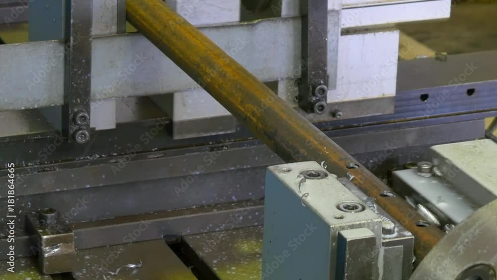 Drilling holes metal iron on industrial CNC machine in factory. Manufacture of refrigeration and ventilation equipment and air conditioners. Modern technologies. Drilling holes metal iron on industrial CNC machine in factory. Manufacture of refrigeration and ventilation equipment and air conditioners. Modern technologies.