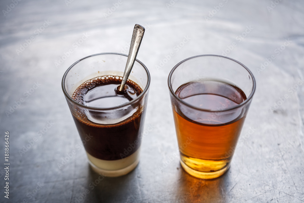 Traditional Thai coffee with chinese tea on side. Traditional Thai coffee with chinese tea on side.