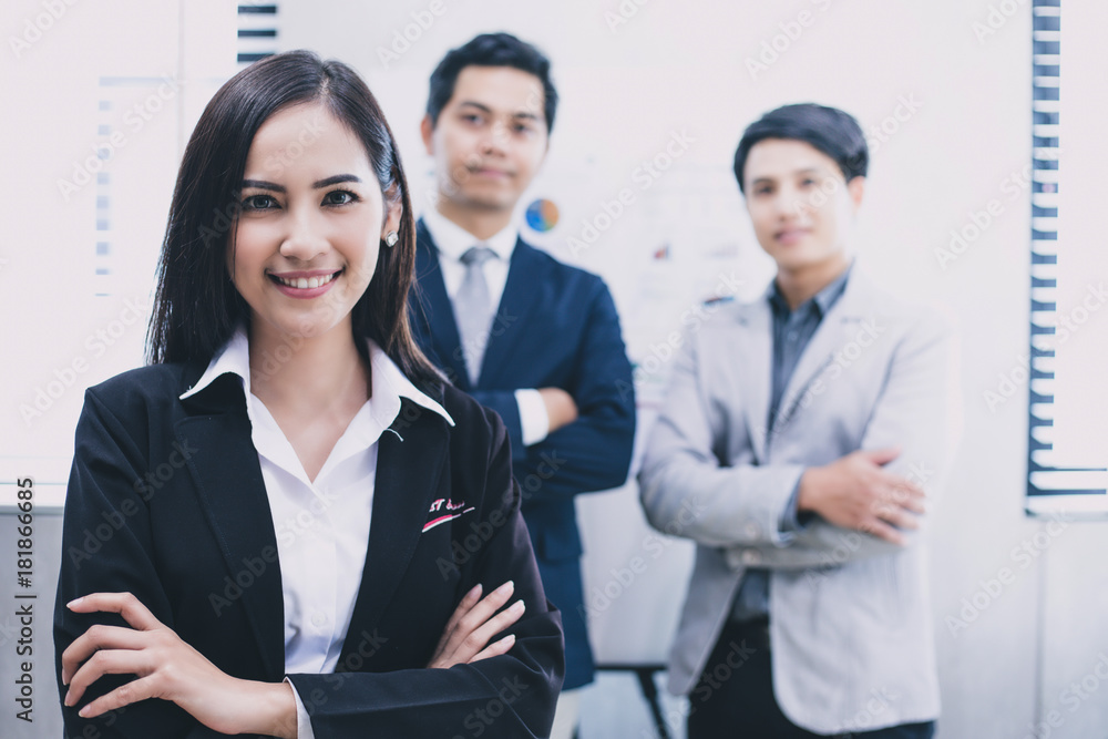 Beautiful Asian business women are smiling and working happy on office background Beautiful Asian business women are smiling and working happy on office background