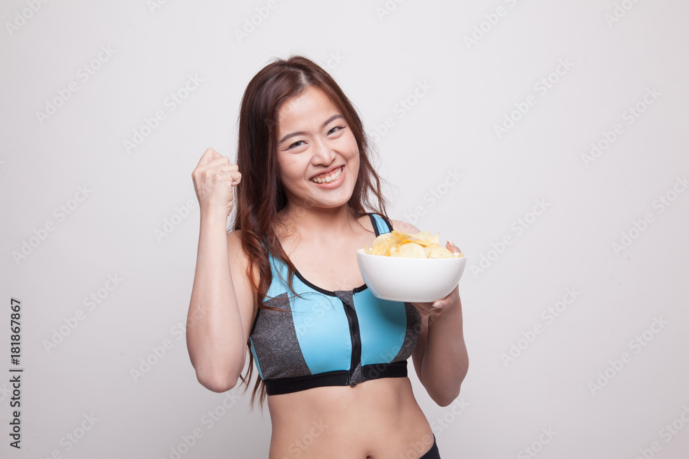 Beautiful Asian healthy girl eat potato chips. Beautiful Asian healthy girl eat potato chips.