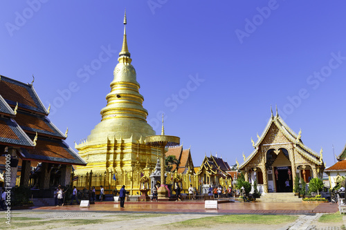 Golden Pagoda and hall in Wat Phra That Hariphunchai at Lamphun north of Thailand