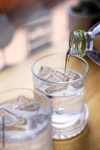 A glass of pure fresh water is poured into a glass