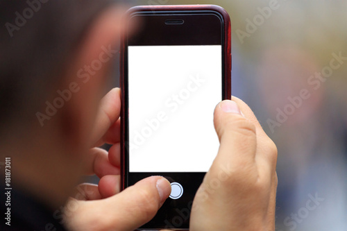Smartphone blank screen template with copy space in man's hands. Blurred background