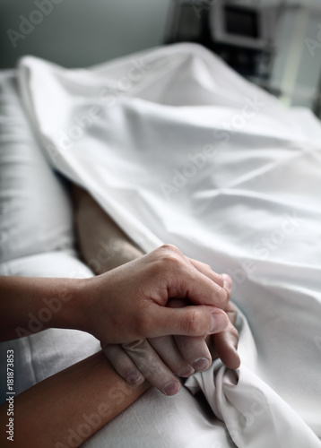 Parting with dead patient covered with bed sheet in the hospital