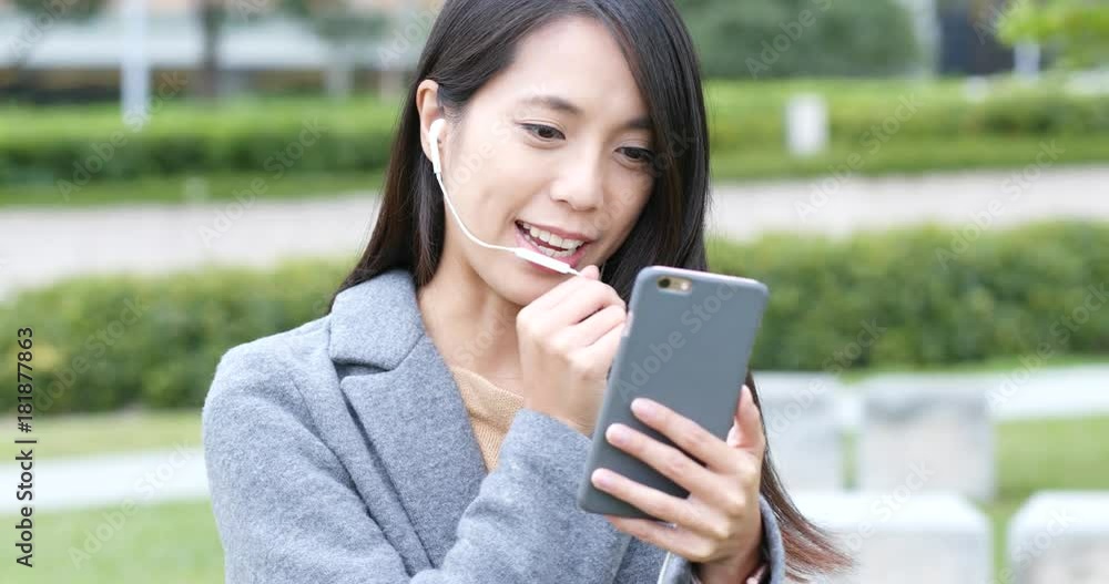 Woman talking on video call at outdoor Woman talking on video call at outdoor