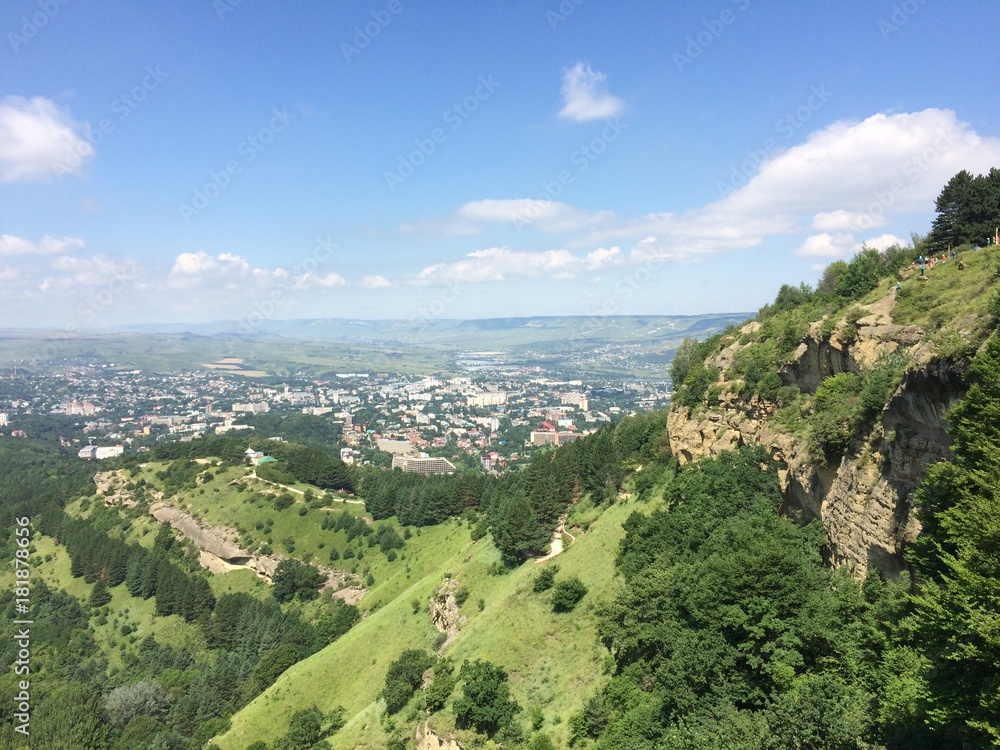 Obraz premium North Caucasus Mountains Cliffs Blue Sky Green Forest Clouds Nature Travels