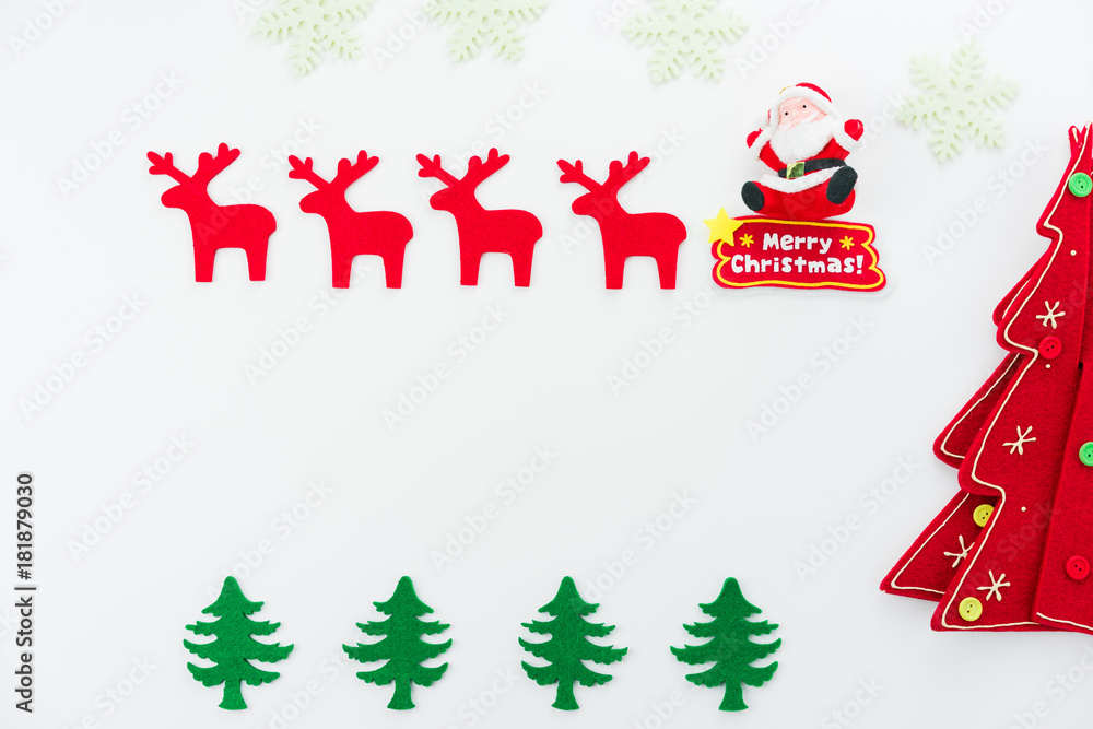 Christmas composition. Christmas tree, dear, Santa Claus on white background. Flat lay, top view Christmas composition. Christmas tree, dear, Santa Claus on white background. Flat lay, top view