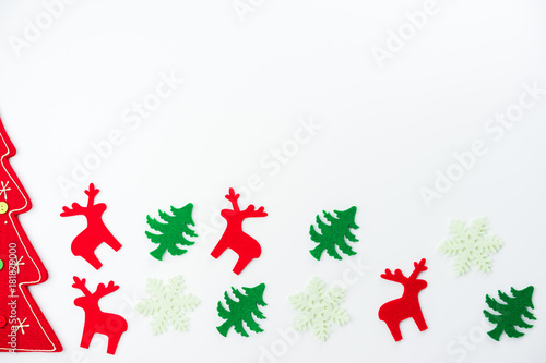 Christmas composition. Christmas tree, dear, Santa Claus on white background. Flat lay, top view © ronnachaipark