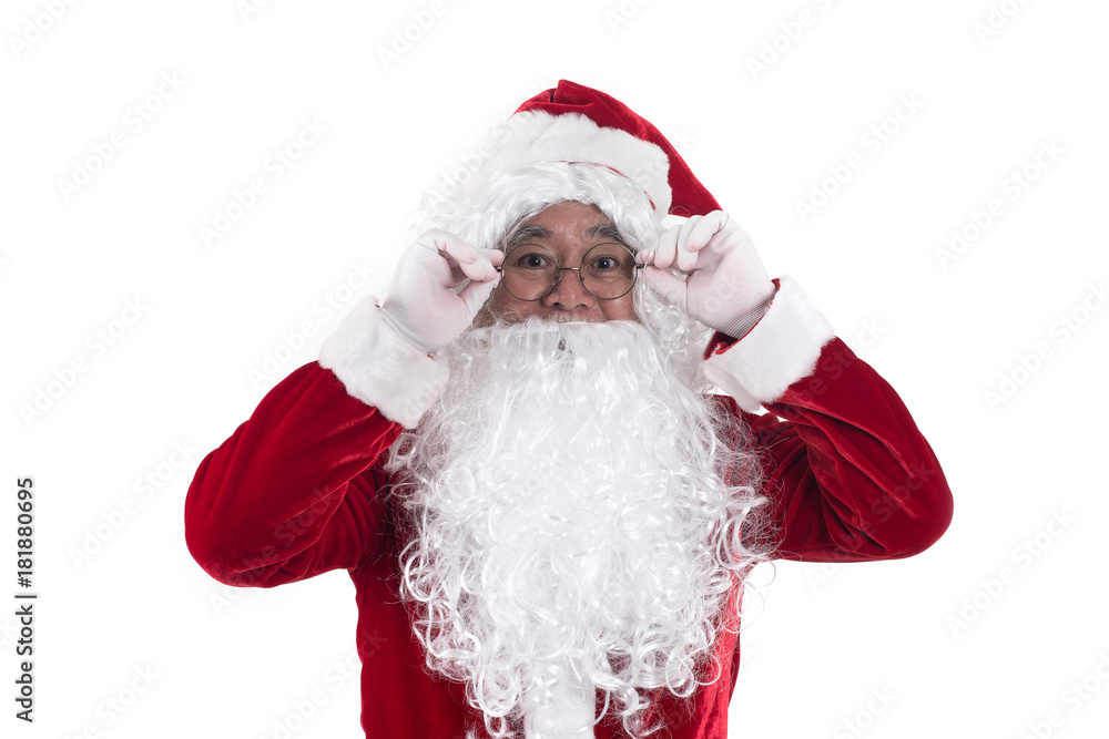 Santa standing holding his hat isolated on white background.