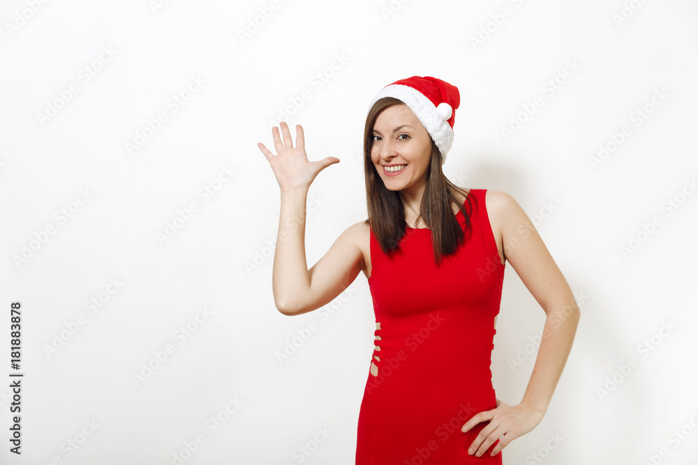 Beautiful caucasian young happy woman with charming smile wearing red dress and Christmas hat showing thumbs five on white background. Santa girl isolated portrait. New Year holiday 2018 concept Beautiful caucasian young happy woman with charming smile wearing red dress and Christmas hat showing thumbs five on white background. Santa girl isolated portrait. New Year holiday 2018 concept