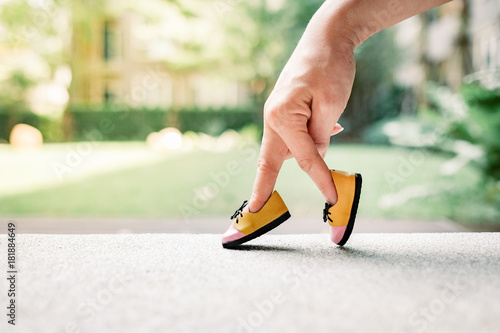 woman hand finger walking with shoe concept 