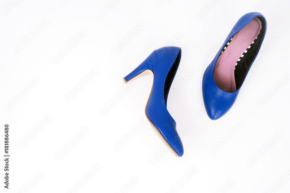 Female blue high-heeled shoes on white background, Flat lay, top view trendy fashion feminine background. Female blue high-heeled shoes on white background, Flat lay, top view trendy fashion feminine background.