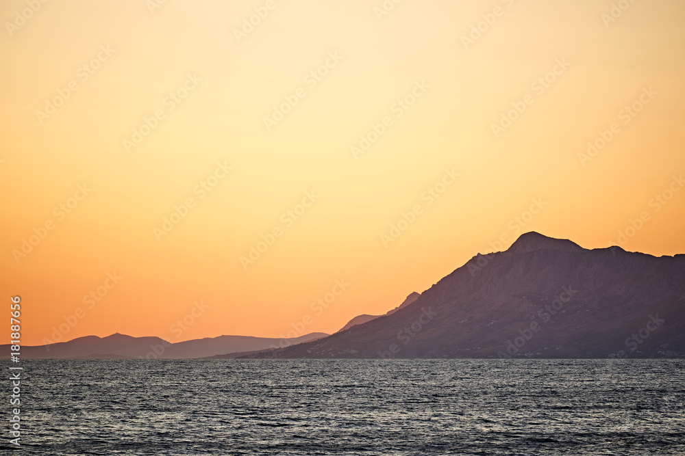 Beautiful Adriatic Sea bay with mountains on sunset