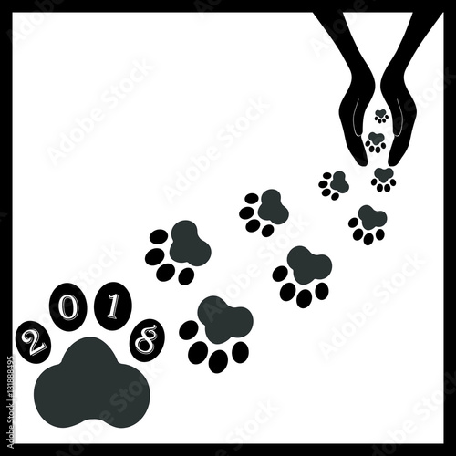 Black footprints dogs in hands1 photo