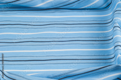 Texture, background, pattern. Woolen fabric is blue, striped. Outdoor family travel and vacation wallpaper with a checkered pattern pattern. Blue and white fabric fabric lines.