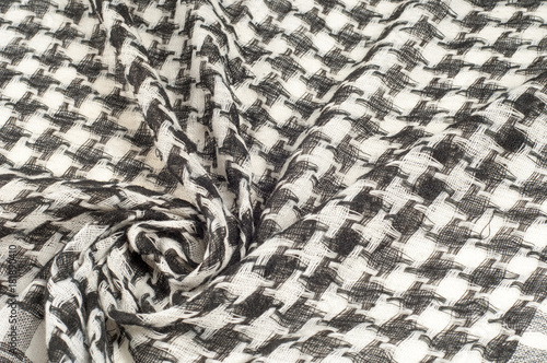 Background texture, pattern. Scarf wool like Yasir Arafat. The Palestinian keffiyeh  is a gender-neutral chequered black and white scarf that is usually worn around the neck or head. photo