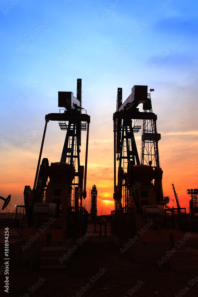 the silhouette of oilfield derrick the silhouette of oilfield derrick