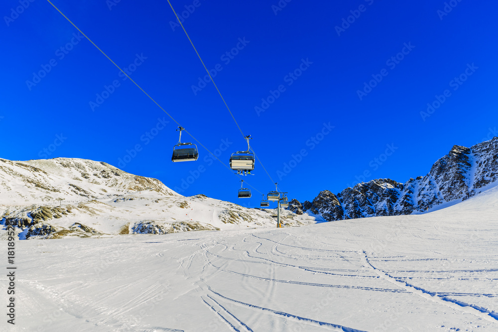 Ski slopes and ski lifts in the Alps.
