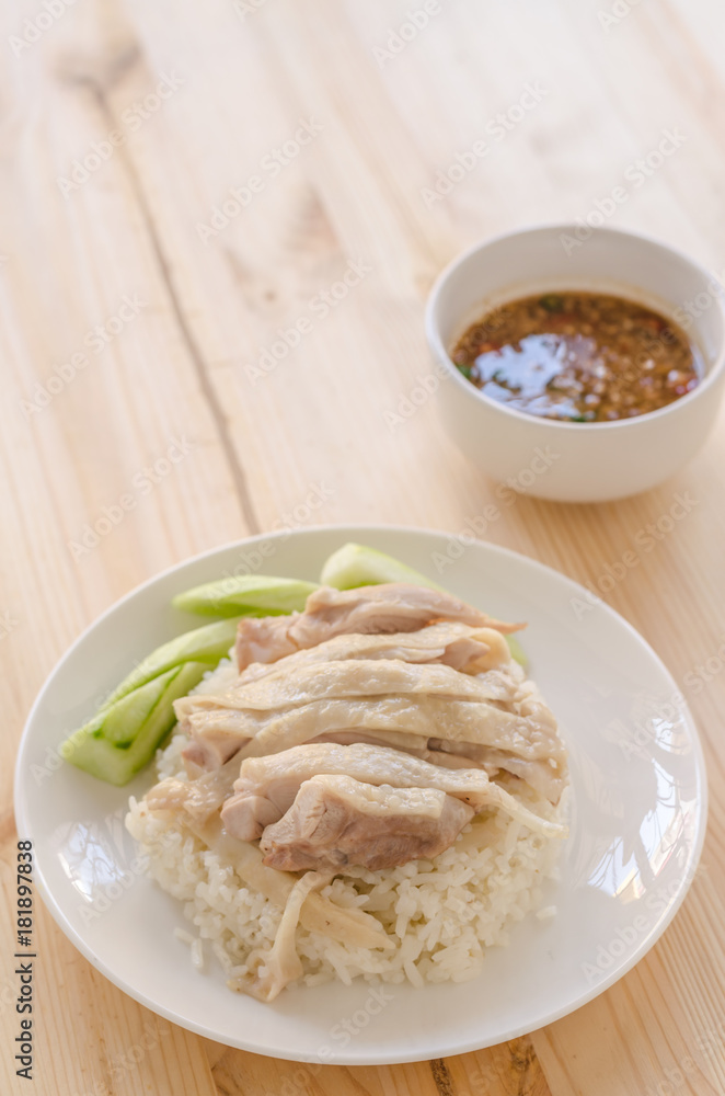Hainanese chicken rice or rice cooked in chicken broth Hainanese chicken rice or rice cooked in chicken broth