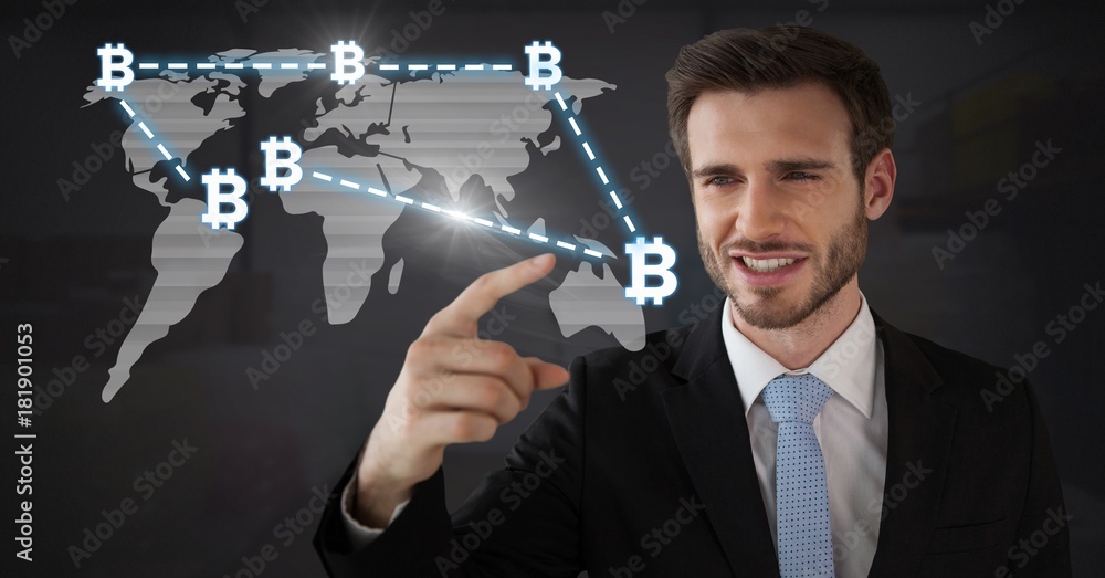 Businessman touching bitcoin graphic icons on world map Businessman touching bitcoin graphic icons on world map
