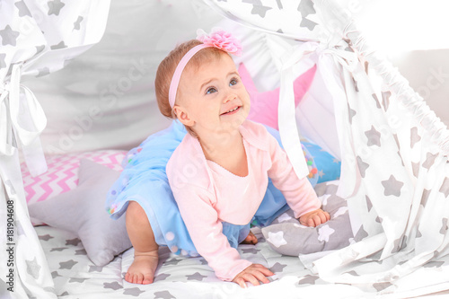 Cute baby in festive clothe...