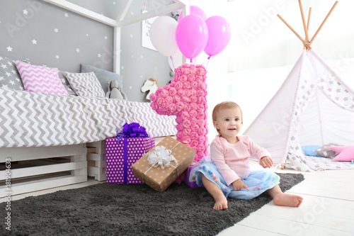 Cute baby with birthday pre...