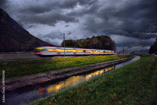 train in the Alps in the evening