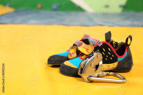 Shoes and carbine on sport mat