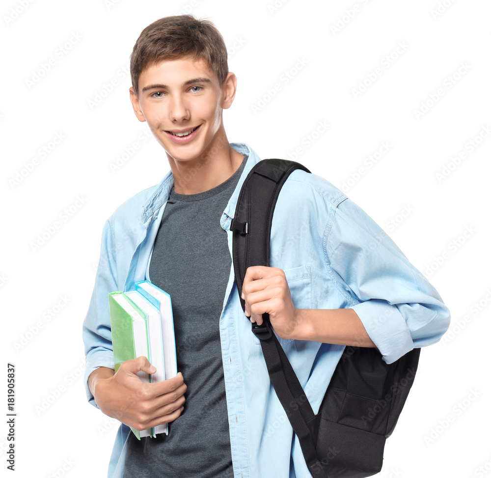 Teenager boy with backpack and books on white background Teenager boy with backpack and books on white background